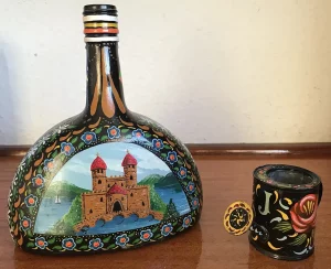 Glass Bottle and Miniature Watering Can